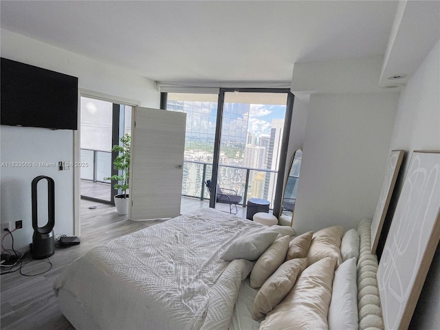 801 S Miami Ave Unit 4204, Miami, FL 33130 - bedroom featuring floor to ceiling windows and light wood-type flooring