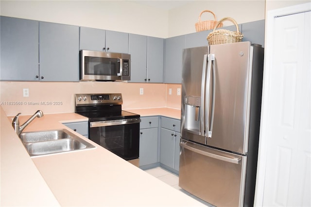 9123 SW 152nd Path, Miami, FL 33196 - kitchen featuring stainless steel appliances, gray cabinets, and light countertops