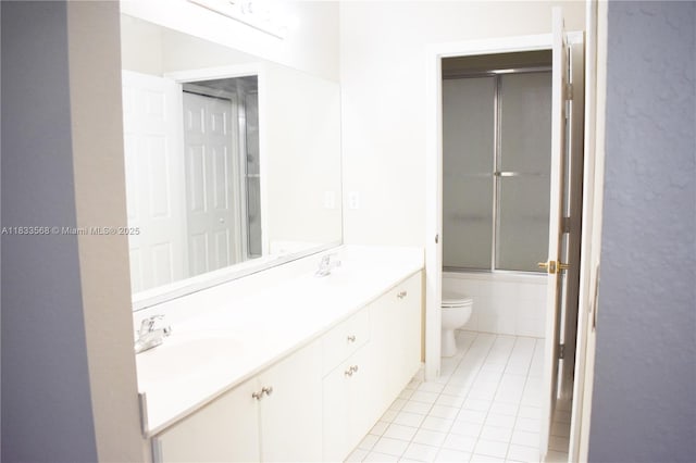 9123 SW 152nd Path, Miami, FL 33196 - full bathroom featuring tile patterned flooring, bath / shower combo with glass door, and double vanity