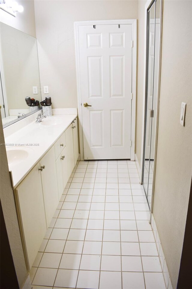 9123 SW 152nd Path, Miami, FL 33196 - bathroom featuring double vanity and tile patterned flooring