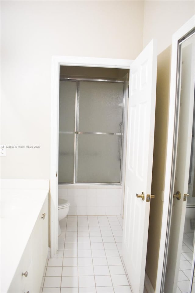 9123 SW 152nd Path, Miami, FL 33196 - bathroom featuring vanity, tile patterned flooring, and shower / bath combination with glass door