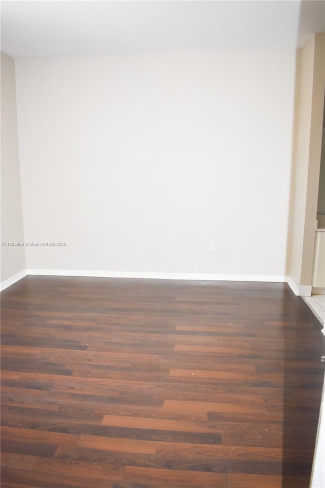 9123 SW 152nd Path, Miami, FL 33196 - empty room with dark wood-type flooring and baseboards