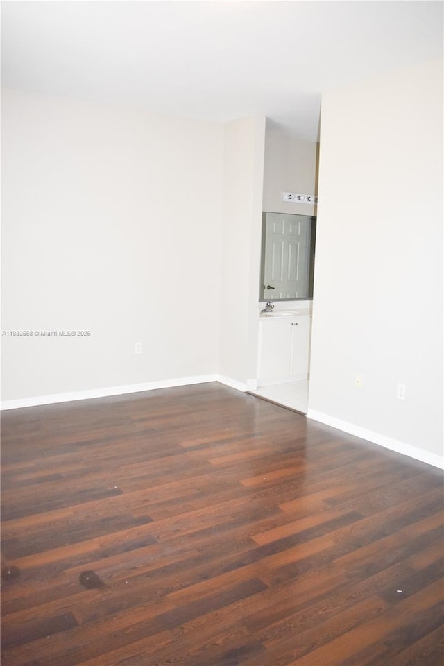 9123 SW 152nd Path, Miami, FL 33196 - empty room featuring dark wood-type flooring and baseboards
