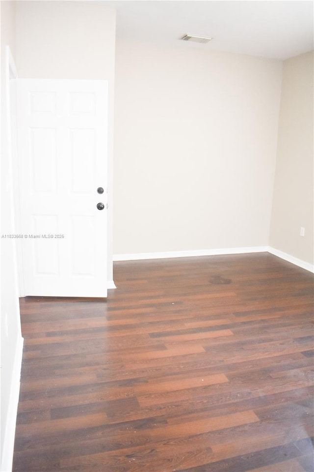 9123 SW 152nd Path, Miami, FL 33196 - spare room featuring dark wood finished floors and baseboards