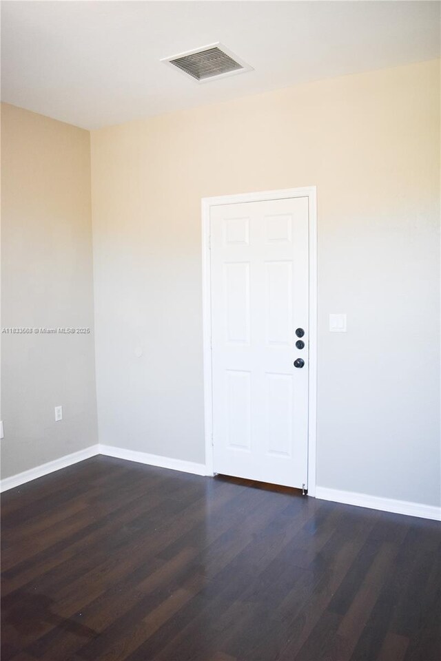 9123 SW 152nd Path, Miami, FL 33196 - spare room featuring dark wood finished floors and baseboards