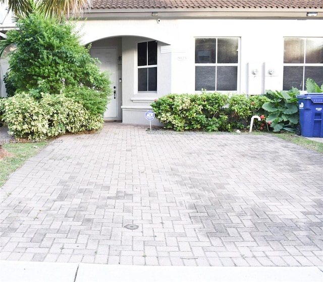 9123 SW 152nd Path, Miami, FL 33196 - property entrance featuring a tile roof and stucco siding