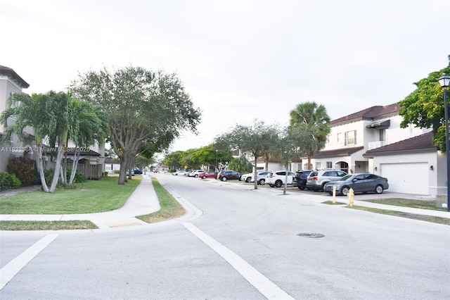9123 SW 152nd Path, Miami, FL 33196 - view of asphalt street featuring sidewalks, street lights, and a residential view