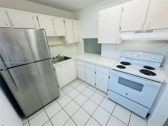 505 NW 177th St Unit 139, Miami Gardens, FL 33169 - kitchen featuring freestanding refrigerator, white electric stove, under cabinet range hood, light countertops, and light tile patterned floors