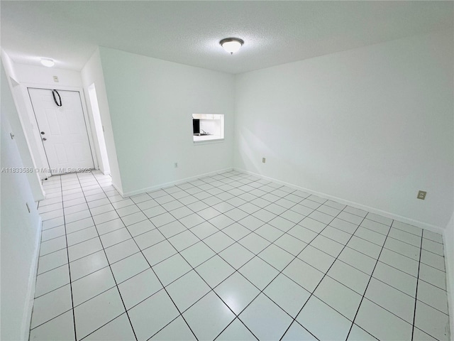 505 NW 177th St Unit 139, Miami Gardens, FL 33169 - spare room with light tile patterned floors and a textured ceiling