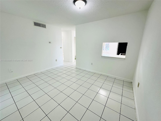 505 NW 177th St Unit 139, Miami Gardens, FL 33169 - unfurnished room with a textured ceiling and light tile patterned flooring