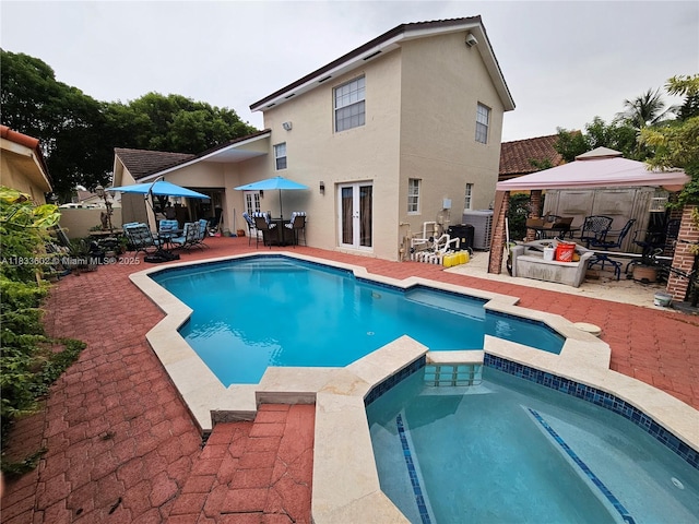 15126 NW 90th Ct, Miami Lakes, FL 33018 - view of pool featuring outdoor dining area, a gazebo, a pool with connected hot tub, and a patio