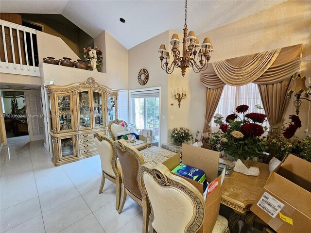 15126 NW 90th Ct, Miami Lakes, FL 33018 - dining space featuring high vaulted ceiling, a chandelier, and light tile patterned floors