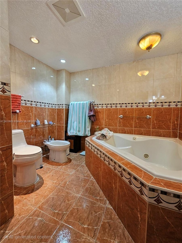 15126 NW 90th Ct, Miami Lakes, FL 33018 - full bathroom with tile walls, a jetted tub, a textured ceiling, and a bidet