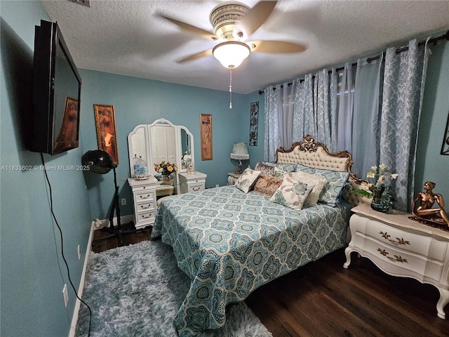 15126 NW 90th Ct, Miami Lakes, FL 33018 - bedroom featuring dark wood-style floors, a textured ceiling, and a ceiling fan