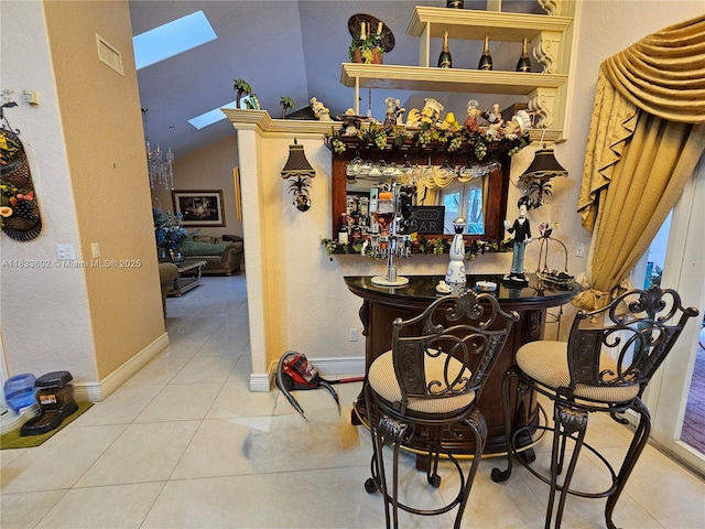 15126 NW 90th Ct, Miami Lakes, FL 33018 - indoor bar with a skylight, tile patterned flooring, and vaulted ceiling