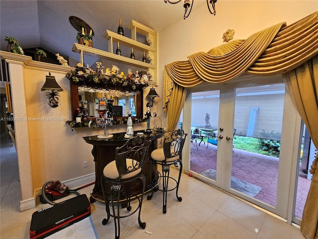 15126 NW 90th Ct, Miami Lakes, FL 33018 - indoor dry bar with lofted ceiling, tile patterned floors, and french doors