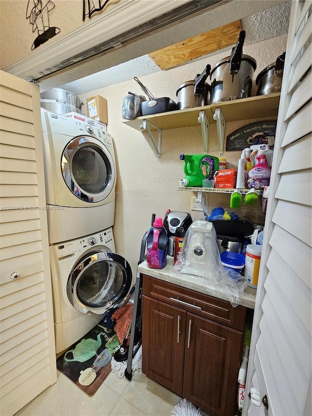 15126 NW 90th Ct, Miami Lakes, FL 33018 - washroom with stacked washer and clothes dryer, light tile patterned floors, and a textured wall