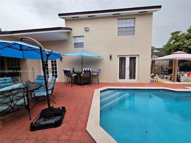 15126 NW 90th Ct, Miami Lakes, FL 33018 - rear view of property featuring french doors, stucco siding, and a patio area