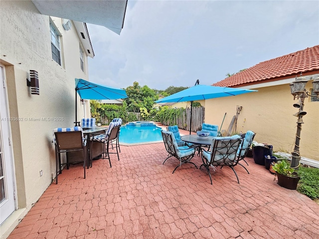 15126 NW 90th Ct, Miami Lakes, FL 33018 - view of swimming pool with outdoor dining area, a pool with connected hot tub, and a patio area