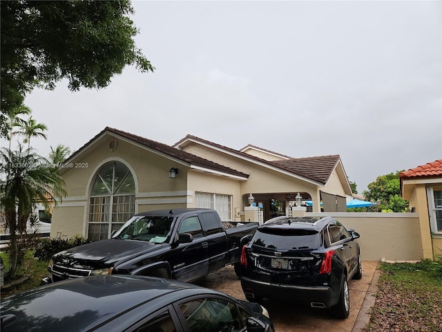 15126 NW 90th Ct, Miami Lakes, FL 33018 - view of home's exterior with stucco siding and a tile roof