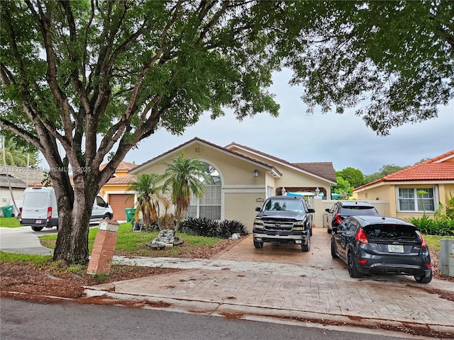 15126 NW 90th Ct, Miami Lakes, FL 33018 - view of front of home featuring stucco siding and concrete driveway