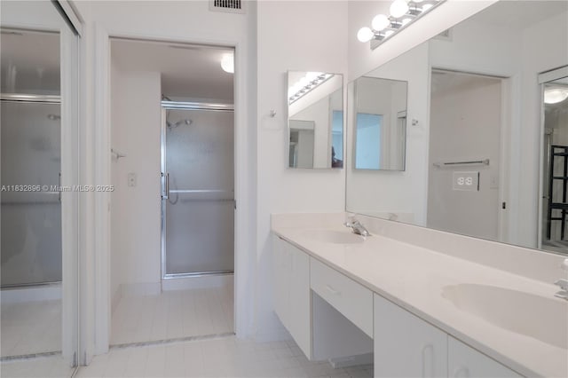 2541 N Nob Hill Rd Unit 309, Sunrise, FL 33322 - full bathroom featuring double vanity, a stall shower, and tile patterned floors
