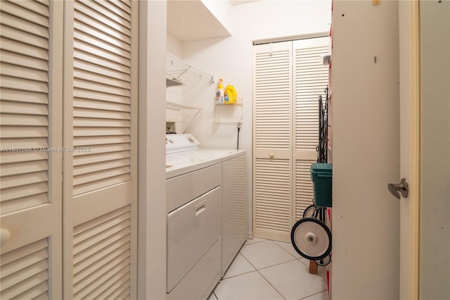 2541 N Nob Hill Rd Unit 309, Sunrise, FL 33322 - laundry area with independent washer and dryer and light tile patterned floors