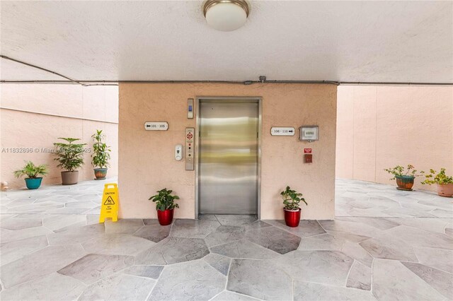2541 N Nob Hill Rd Unit 309, Sunrise, FL 33322 - entrance to property featuring elevator and stucco siding