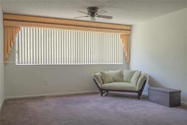2541 N Nob Hill Rd Unit 309, Sunrise, FL 33322 - living area with a ceiling fan, carpet, and a textured ceiling