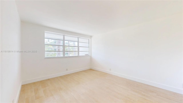 1333 E Hallandale Beach Blvd Unit 326, Hallandale Beach, FL 33009 - spare room with light wood-type flooring and baseboards