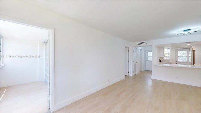 1333 E Hallandale Beach Blvd Unit 326, Hallandale Beach, FL 33009 - unfurnished living room featuring light wood-type flooring