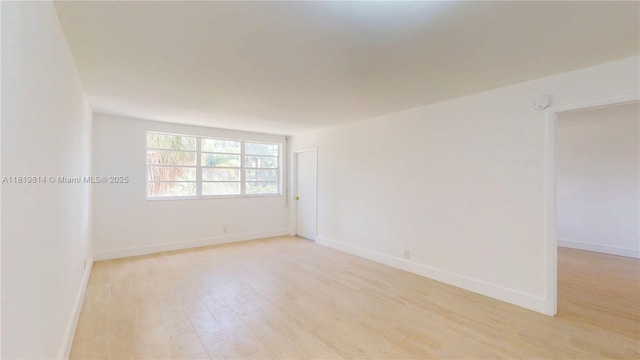 1333 E Hallandale Beach Blvd Unit 326, Hallandale Beach, FL 33009 - unfurnished room featuring light wood-style flooring and baseboards