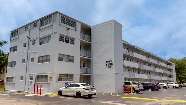 1333 E Hallandale Beach Blvd Unit 326, Hallandale Beach, FL 33009 - view of apartment building / complex featuring uncovered parking
