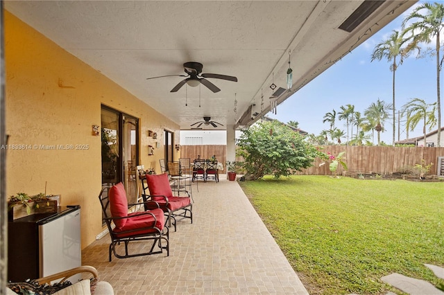 15824 Cotswold Ct, Davie, FL 33331 - fenced backyard featuring a ceiling fan, a patio area, and outdoor dining space