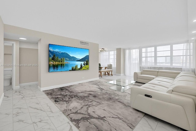 251 174th St Unit 1415, Sunny Isles Beach, FL 33160 - living room with marble look tiles and a chandelier