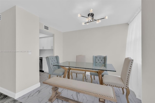 251 174th St Unit 1415, Sunny Isles Beach, FL 33160 - dining room featuring a chandelier and light marble finish floors
