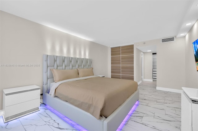 251 174th St Unit 1415, Sunny Isles Beach, FL 33160 - bedroom with marble finish flooring, a closet, and recessed lighting