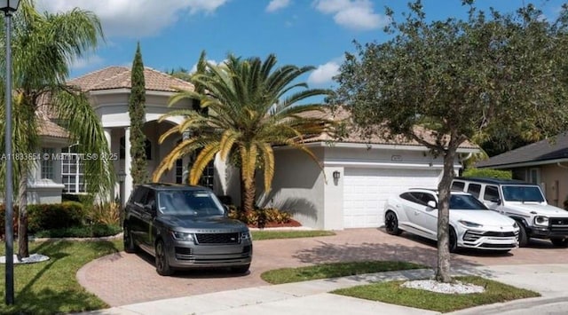 14095 NW 22nd Ct, Pembroke Pines, FL 33028 - view of side of property with decorative driveway, stucco siding, and a garage