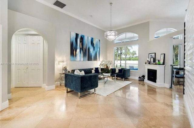 14095 NW 22nd Ct, Pembroke Pines, FL 33028 - living room featuring crown molding, arched walkways, and a chandelier
