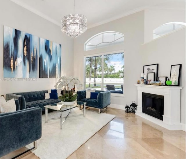 14095 NW 22nd Ct, Pembroke Pines, FL 33028 - living area with ornamental molding, a chandelier, marble tiled floors, a glass covered fireplace, and a high ceiling