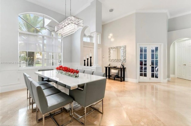 14095 NW 22nd Ct, Pembroke Pines, FL 33028 - dining room with crown molding, healthy amount of natural light, a towering ceiling, arched walkways, and ornate columns