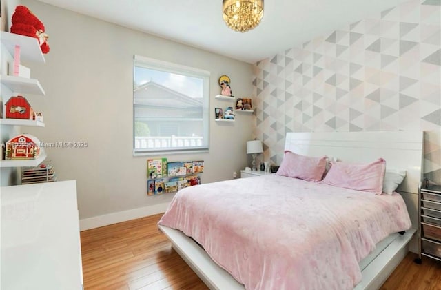 14095 NW 22nd Ct, Pembroke Pines, FL 33028 - bedroom with wood finished floors and an accent wall
