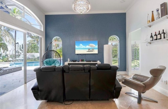 14095 NW 22nd Ct, Pembroke Pines, FL 33028 - living room with healthy amount of natural light, an accent wall, a chandelier, crown molding, and a towering ceiling