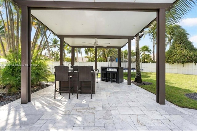 14095 NW 22nd Ct, Pembroke Pines, FL 33028 - fenced backyard with a ceiling fan and a patio