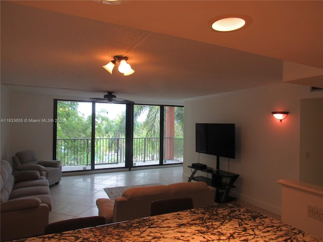 1101 River Reach Dr Unit 418, Fort Lauderdale, FL 33315 - living area with floor to ceiling windows, a ceiling fan, and tile patterned flooring