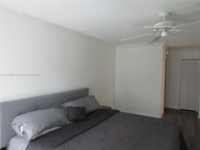 1101 River Reach Dr Unit 418, Fort Lauderdale, FL 33315 - bedroom featuring a textured ceiling, a ceiling fan, and ornamental molding