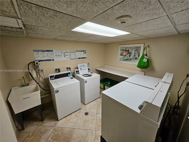 1101 River Reach Dr Unit 418, Fort Lauderdale, FL 33315 - shared laundry room featuring washer and clothes dryer and light tile patterned floors