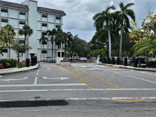 1101 River Reach Dr Unit 418, Fort Lauderdale, FL 33315 - view of asphalt street with curbs and a gated entry