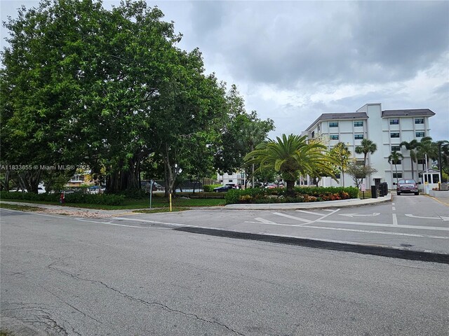 1101 River Reach Dr Unit 418, Fort Lauderdale, FL 33315 - view of asphalt road featuring curbs
