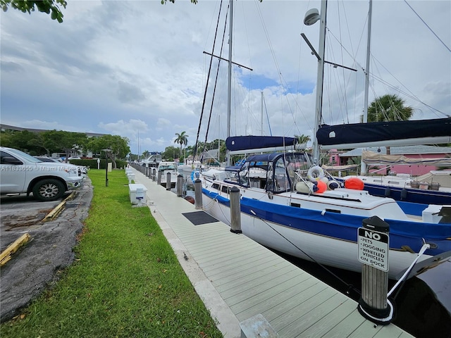 1101 River Reach Dr Unit 418, Fort Lauderdale, FL 33315 - dock featuring a lawn